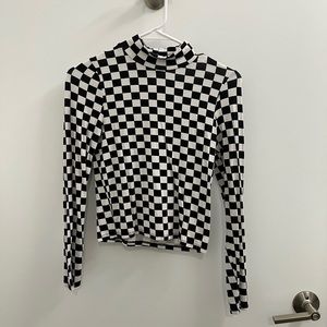 Subdued checkered mock neck top